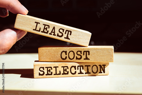 Wooden blocks with words 'Least Cost Selection'.