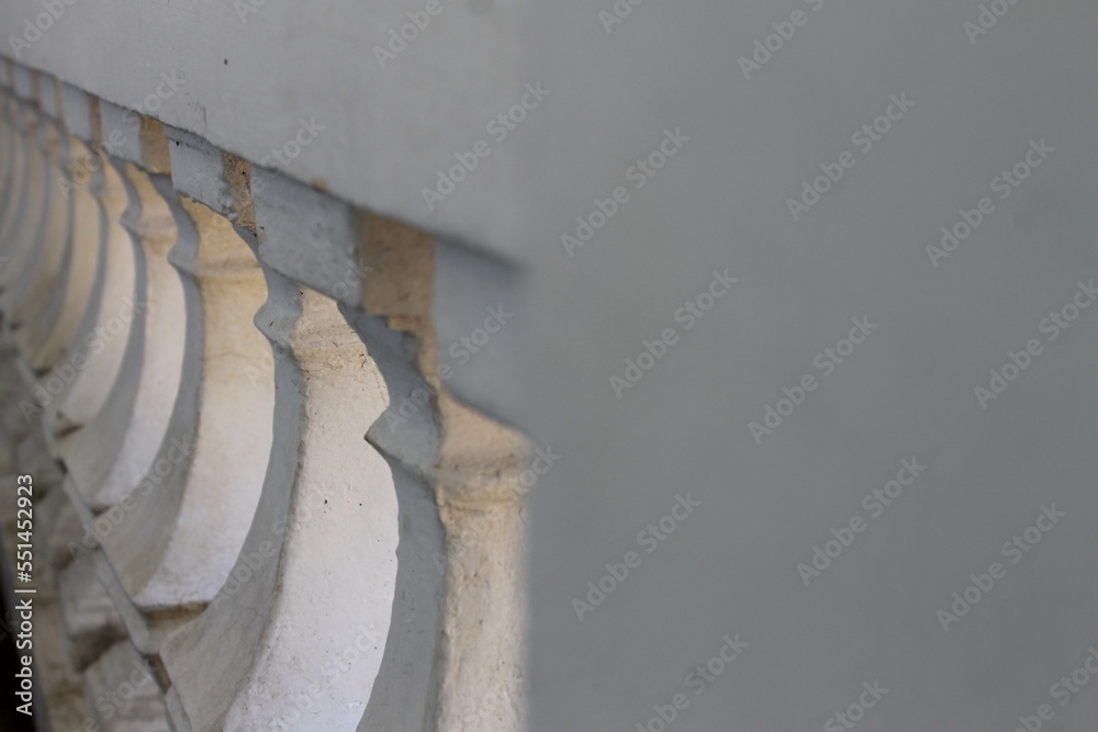 The fence of the house is a row of white pawns The fence of the house is a row of white pawns