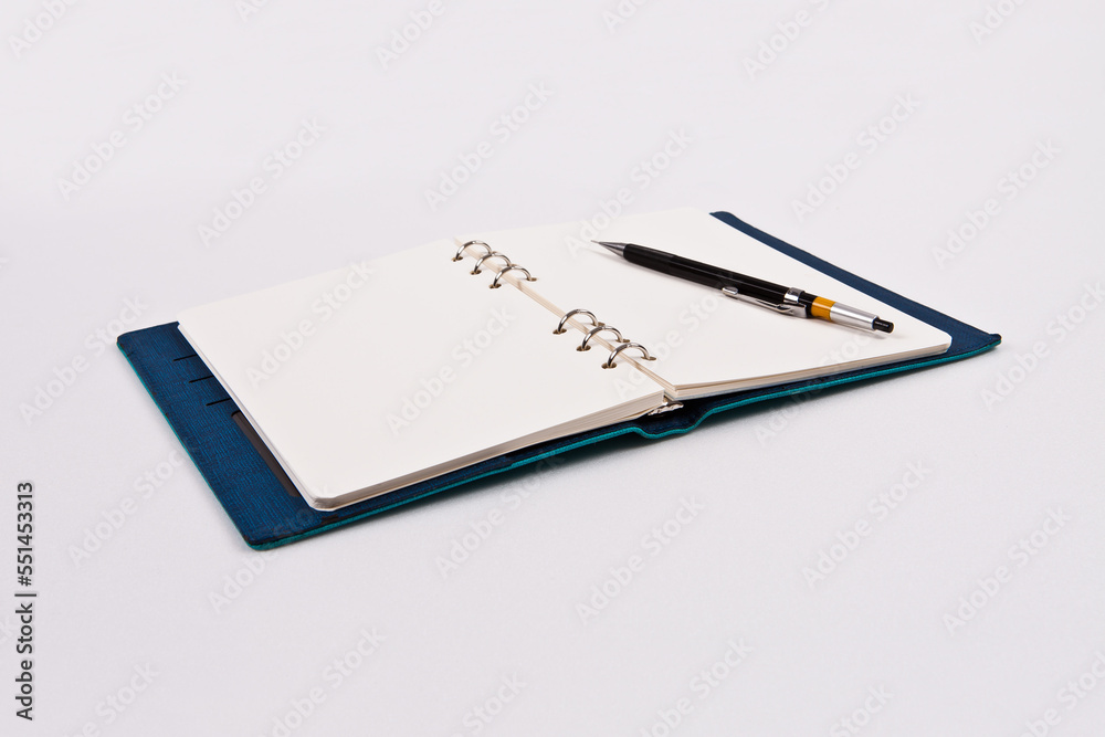 A pen is placed on a diary of blank notes, against the background. You can change the background to any image you want. A pen is placed on a diary of blank notes, against the background. You can change the background to any image you want.