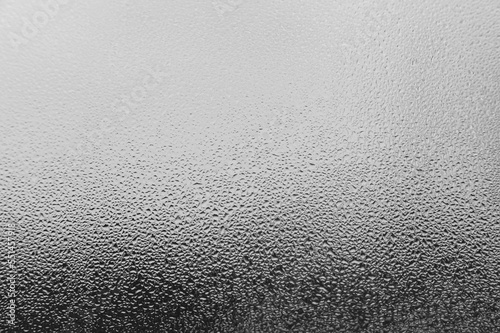 Dew drops and condensation on glass, cold season and high humidity on windows in houses.