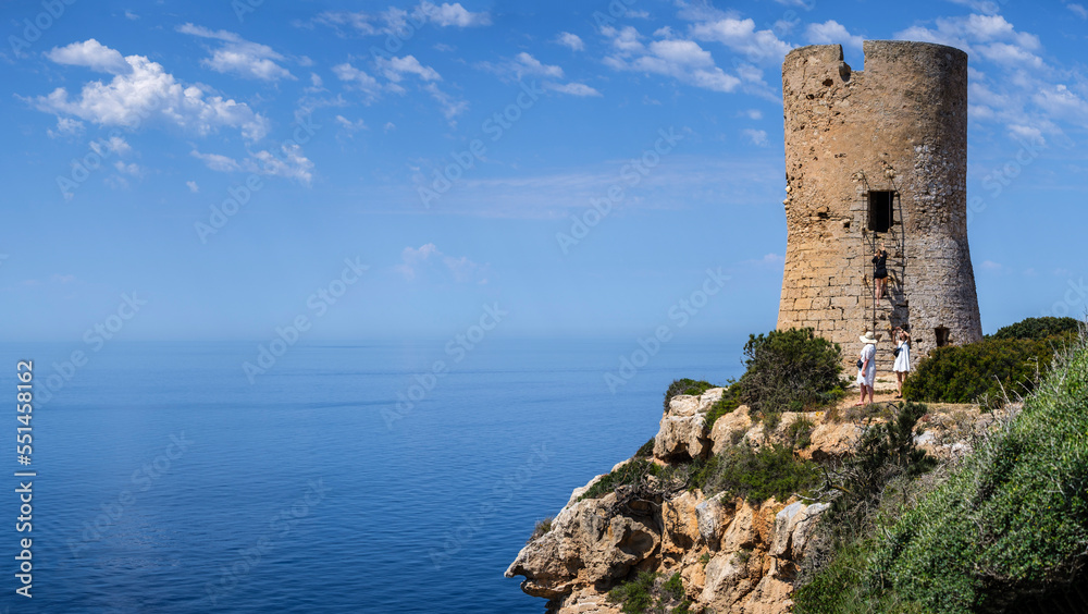 tourists visiting Cap Blanc tower built in 1579, llucmajor, Mallorca, Balearic Islands, Spain