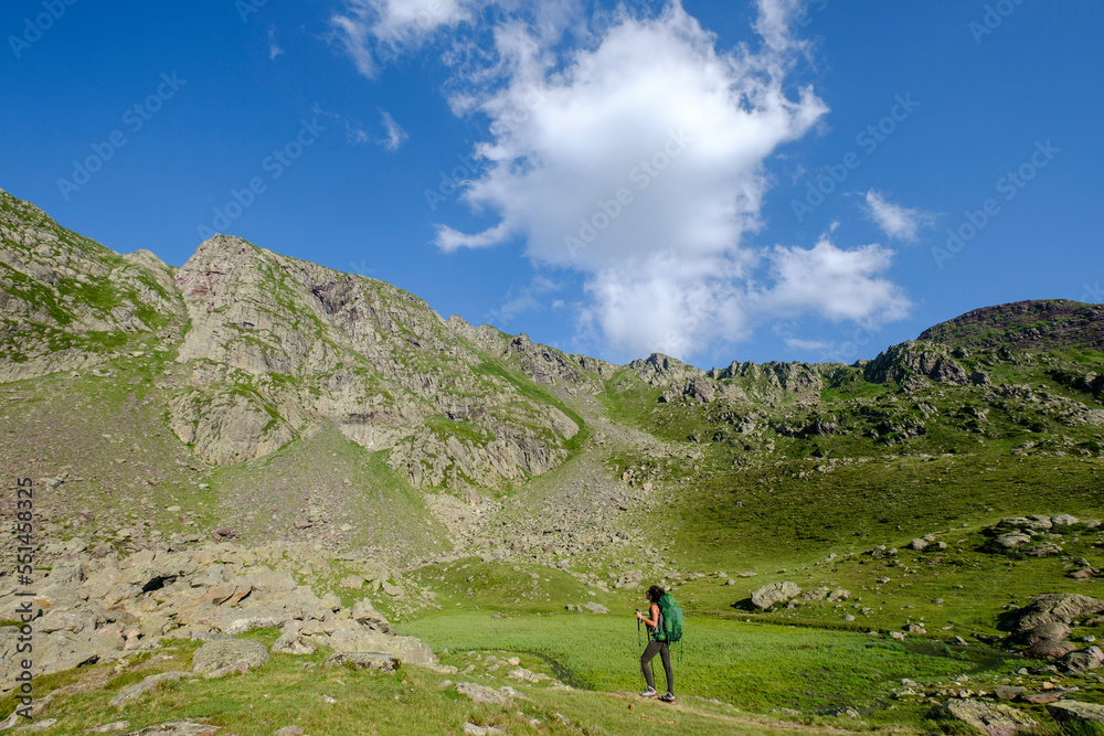 hiker on Lac Bersau, Ayous lakes tour, Pyrenees National Park, Pyrenees Atlantiques, France