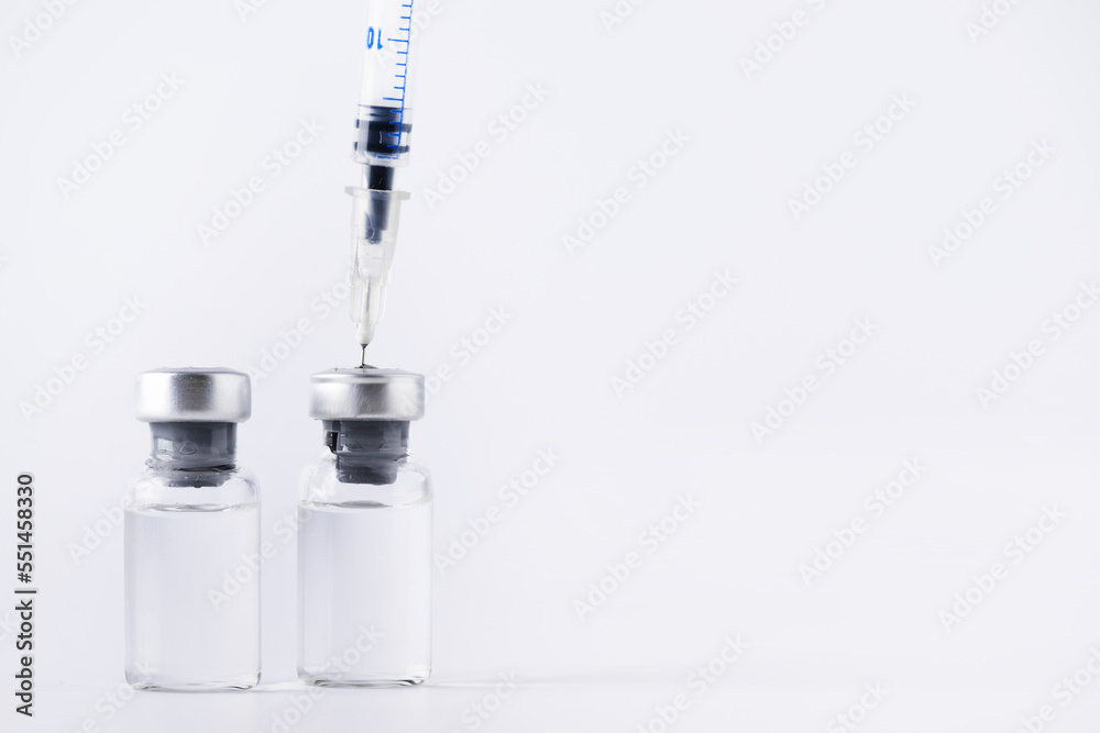 Glass vial and syringe with injection. Vaccination or beauty therapy concept. Glass vial and syringe with injection. Vaccination or beauty therapy concept.