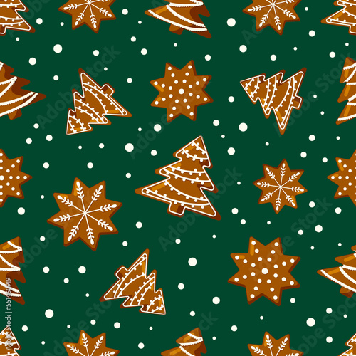 Seamless christmas pattern with gingerbread cookies on green background. Flat vector illustration.