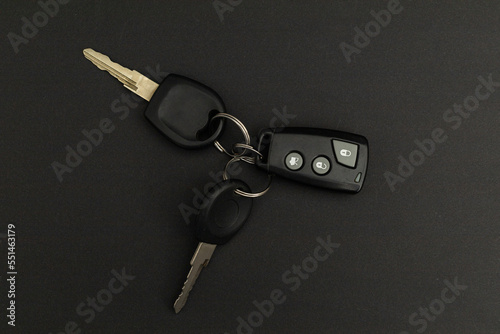 Car keys on black background