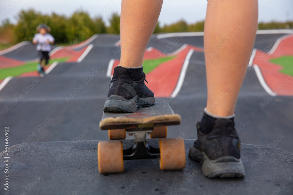 close up on young boy feet and skateboard close up on young boy feet and skateboard