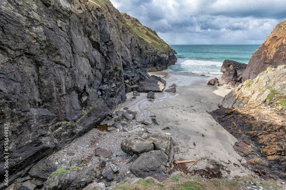 Soapy Cove on the lizard peninsular Cornwall showing water falls seals and their pups 
