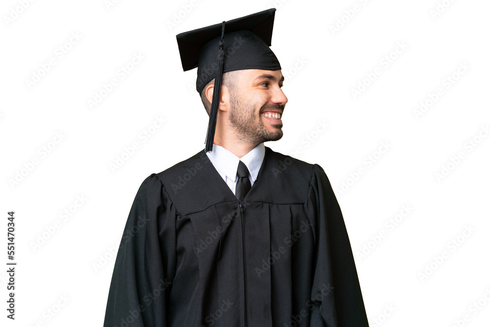 Young university graduate man over isolated chroma key background looking side Young university graduate man over isolated chroma key background looking side