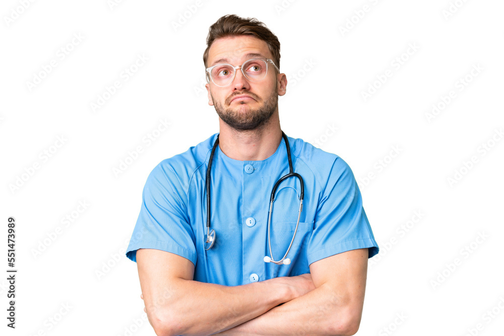 Young nurse man over isolated chroma key background making doubts gesture while lifting the shoulders Young nurse man over isolated chroma key background making doubts gesture while lifting the shoulders