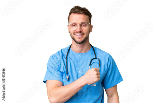 Young nurse man over isolated chroma key background celebrating a victory