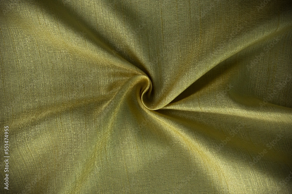 Golden folding and wavy silk, cottons, cloth textiles, fabric background design, moern yellow fashion material for premium decorations.