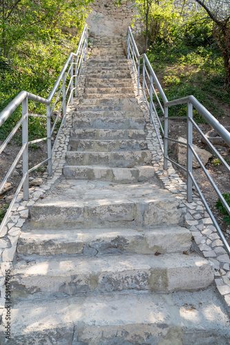 Fototapeta Naklejka Na Ścianę i Meble -  A new stone staircase of 800 steps to Jasper Beach, built in the spring of 2020. The reserve on the Black Sea. Cape Fiolent, Crimea Peninsula. The concept of unity with nature, outdoor activities.