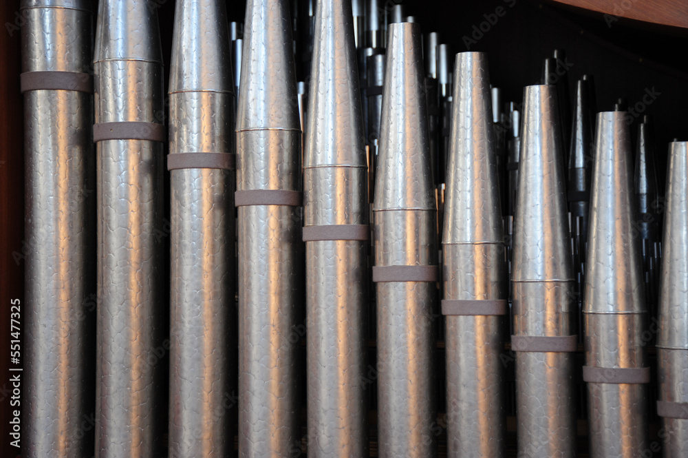 Church pipes attached to an organ indoors. Church pipes attached to an organ indoors.