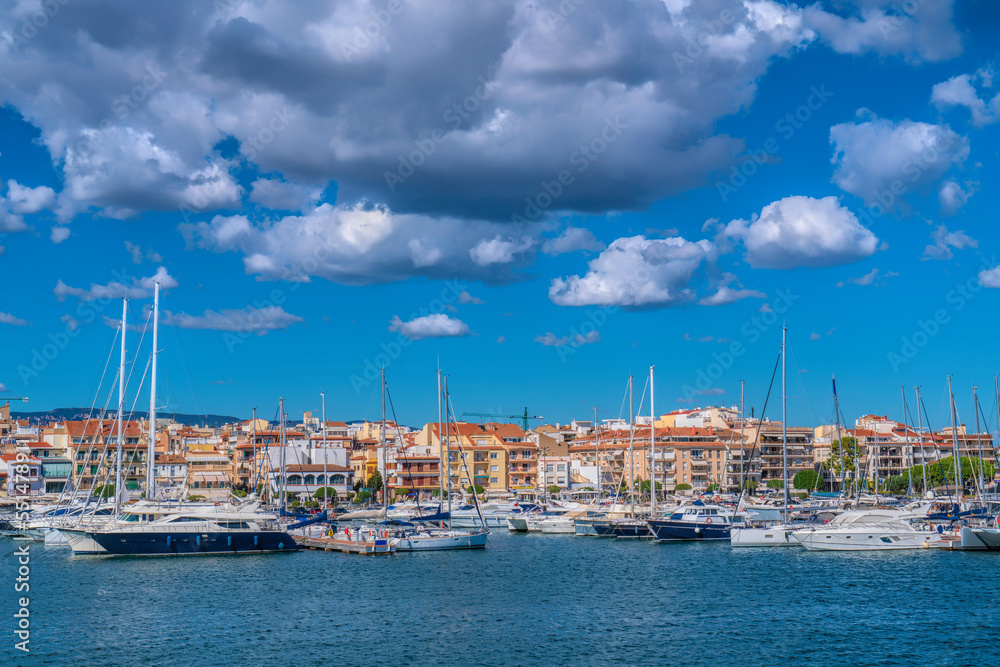 Cambrils Spain yachts and boats in marina Catalonia Tarragona Province with blue Mediterranean sea and sky