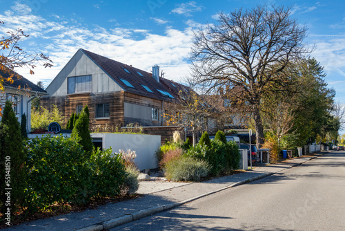 Germany, Bavaria, Munich, Street in front of modern passive house with wooden walls