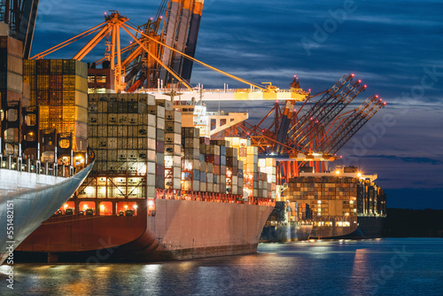 Germany, Hamburg, Container ships in Port of Hamburg at night
