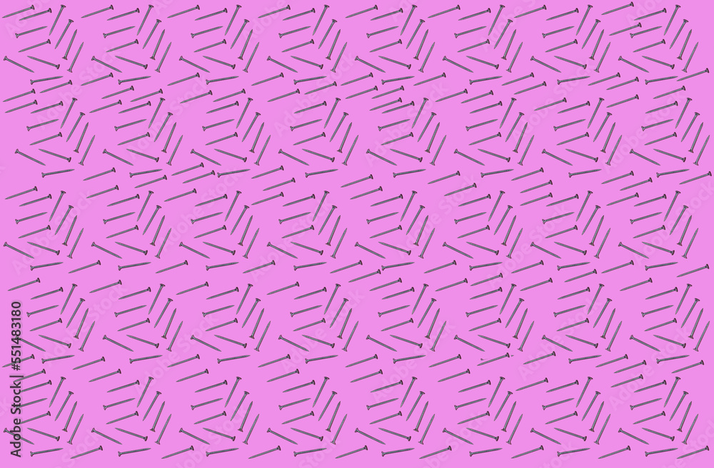 Pattern of rows of screws flat laid against pink background Pattern of rows of screws flat laid against pink background