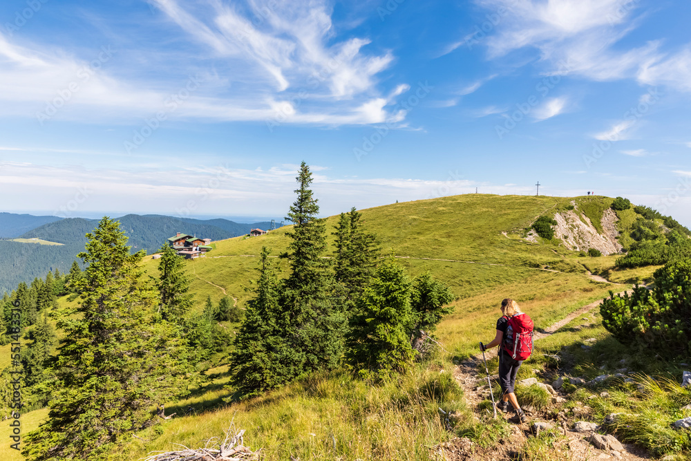Germany, Bavaria, Female hiker following trail leading to alpine huts in Bavarian Prealps Germany, Bavaria, Female hiker following trail leading to alpine huts in Bavarian Prealps