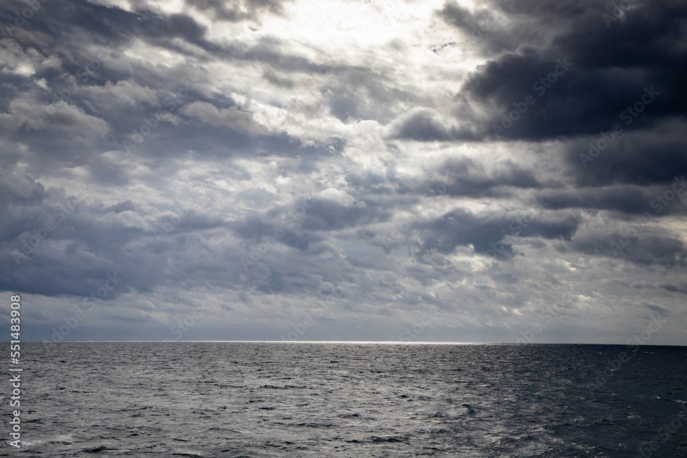 seascape with dark clouds and light