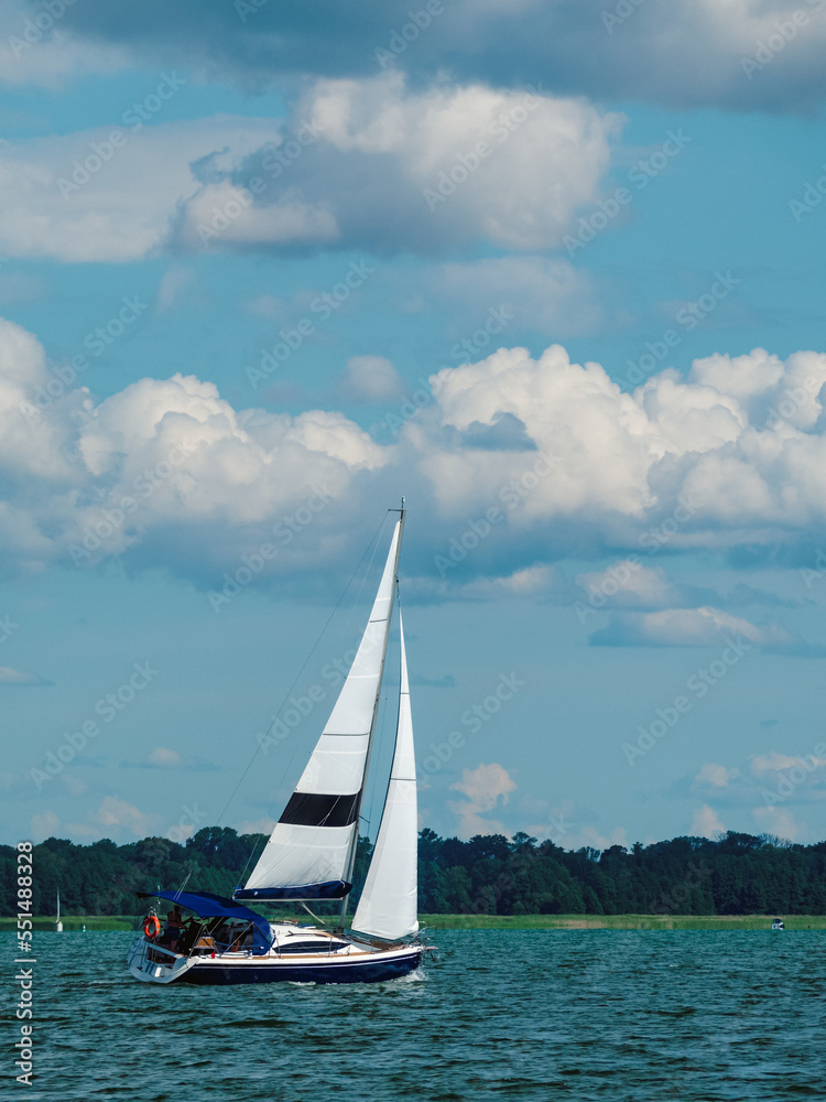 Fototapeta premium one sailing yacht sailing at full sail on a lake