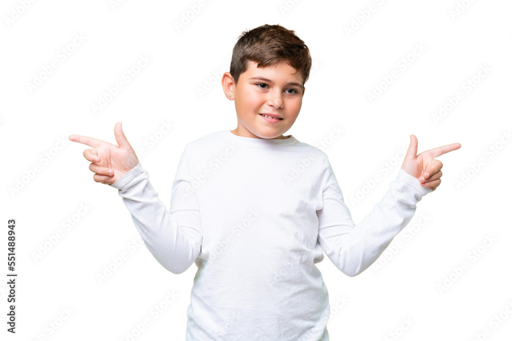 Little caucasian kid over isolated chroma key background pointing finger to the laterals and happy