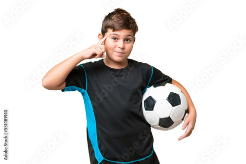 Little caucasian football player kid over isolated chroma key background thinking an idea