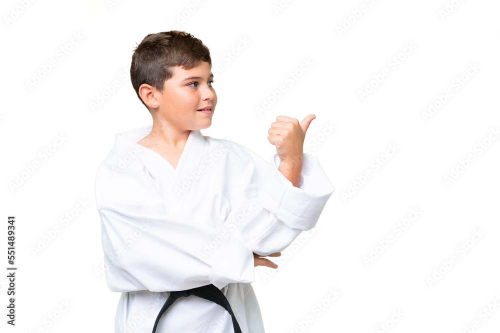 Little caucasian kid over isolated chroma key background pointing to the side to present a product Little caucasian kid over isolated chroma key background pointing to the side to present a product
