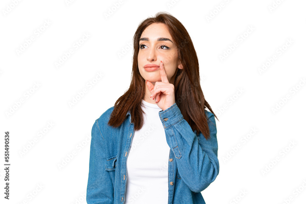 Young caucasian woman over isolated chroma key background having doubts while looking up Young caucasian woman over isolated chroma key background having doubts while looking up
