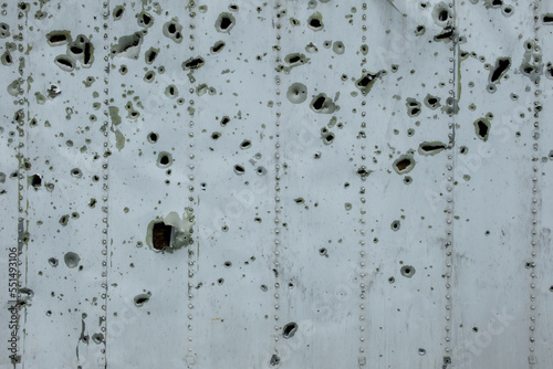 Traces of shelling. Holes from shell fragments. War in Ukraine.