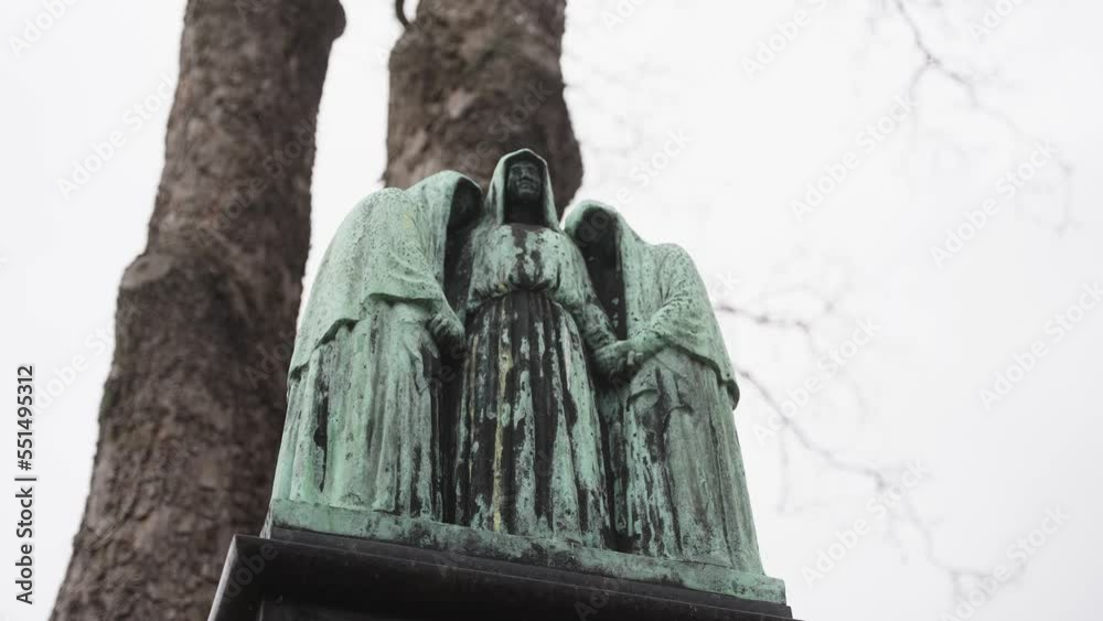 Oxidized copper statue at grave yard (4k 30p Slow Motion)