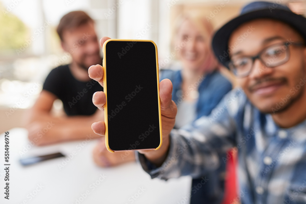 Man showing smartphone during friends meeting