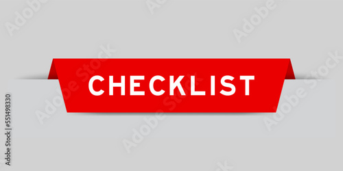 Red color inserted label with word checklist on gray background