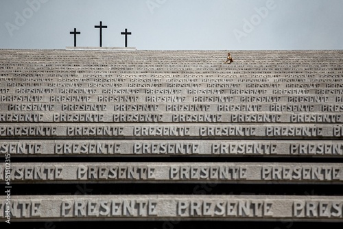 Stony sculpture with text' presente' in italy photo