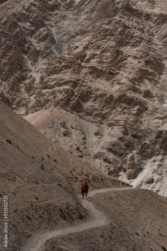 A pair of climbers walking among the mountains of Ladakh