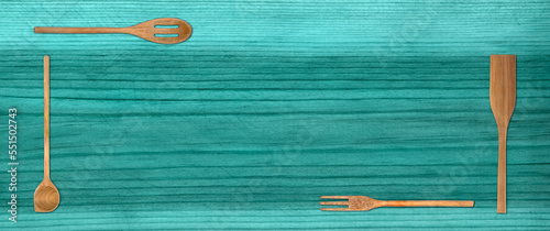 Topview of Set Cooking Wooden Utensils on Blue Table Background photo