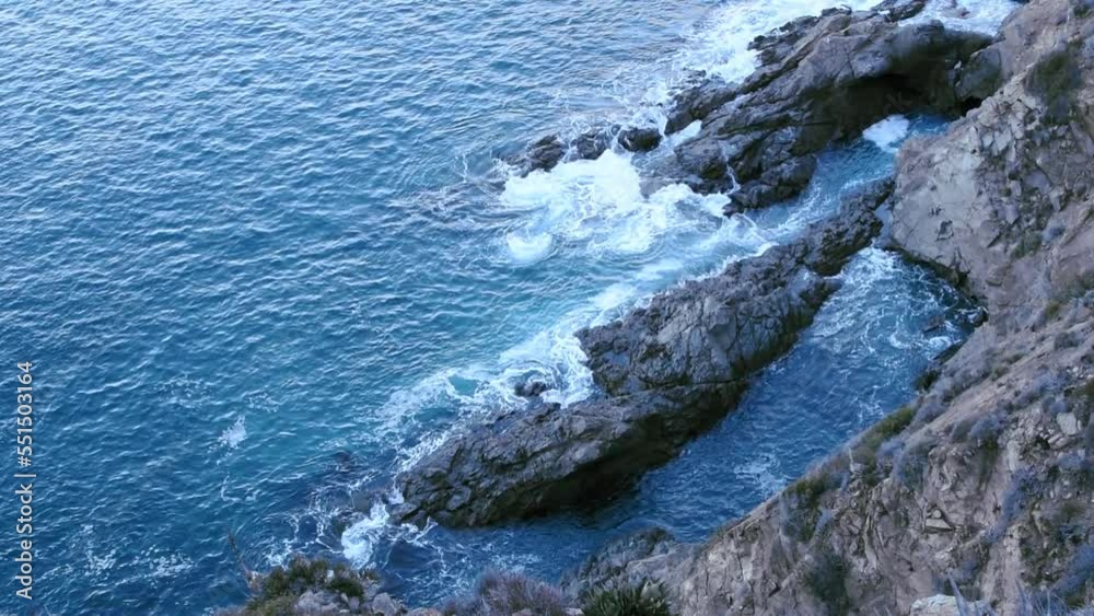 Force of the waves of the sea flowing and colliding with rock formations, seen from a cliff in Punta Brava, Ensenada - Steady cam. Force of the waves of the sea flowing and colliding with rock formations, seen from a cliff in Punta Brava, Ensenada - Steady cam.