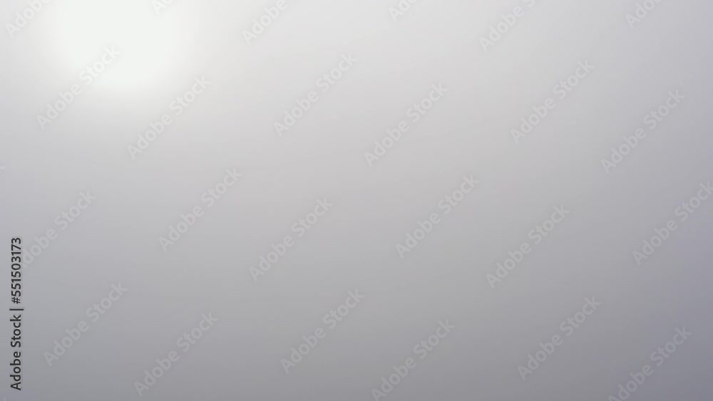 Gradient grey background of mist, sunlight shining through fog Gradient grey background of mist, sunlight shining through fog