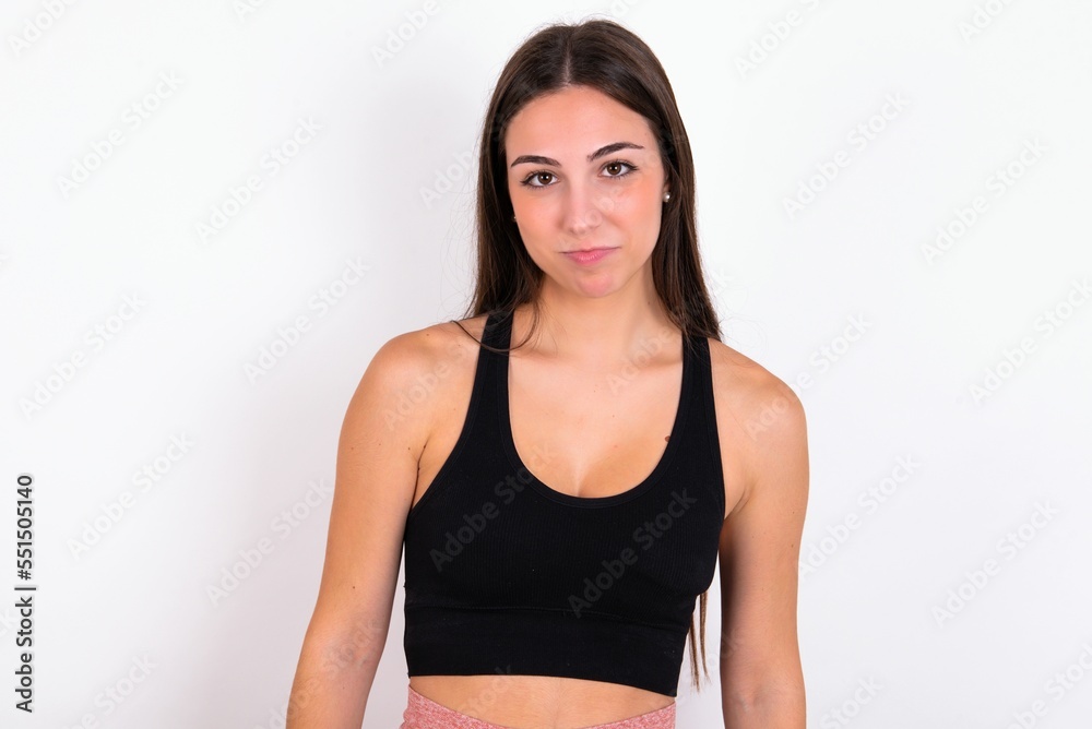 Young caucasian woman wearing sportswear over white background  crying desperate and depressed with tears on his eyes suffering pain and depression. Sad facial expression and emotion concept.