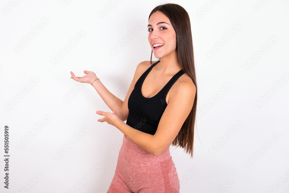 Young caucasian woman wearing sportswear over white background Inviting to enter smiling natural with open hands. Welcome sign. Young caucasian woman wearing sportswear over white background Inviting to enter smiling natural with open hands. Welcome sign.