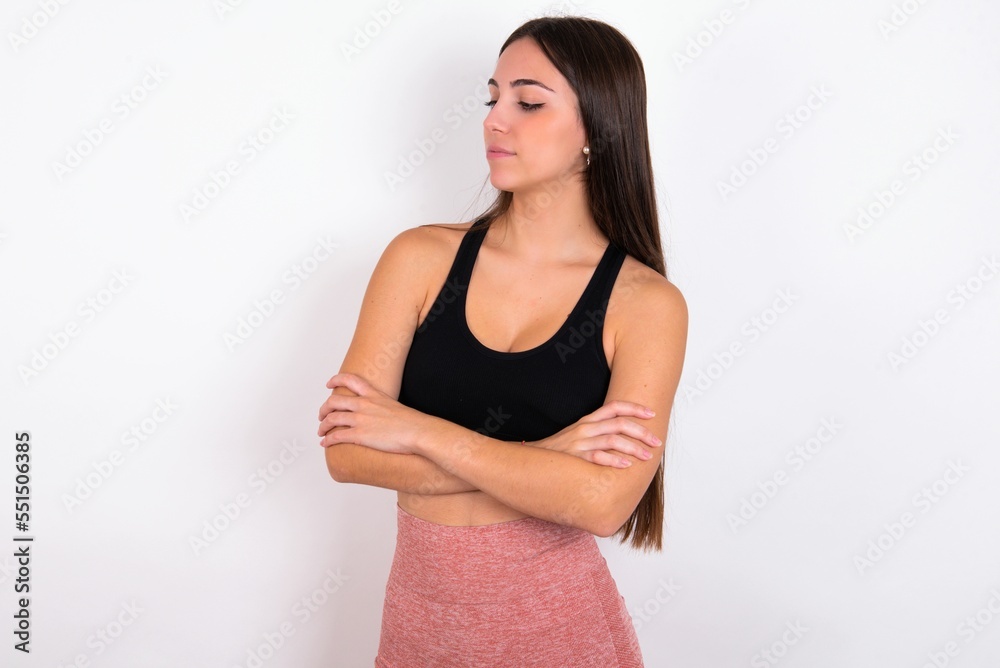 Image of upset MODEL with arms crossed. Looking with disappointed expression aside after listening to bad news. Image of upset MODEL with arms crossed. Looking with disappointed expression aside after listening to bad news.