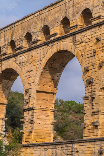 Pont du Gard three-tiered aqueduct from orange limestone  vertical