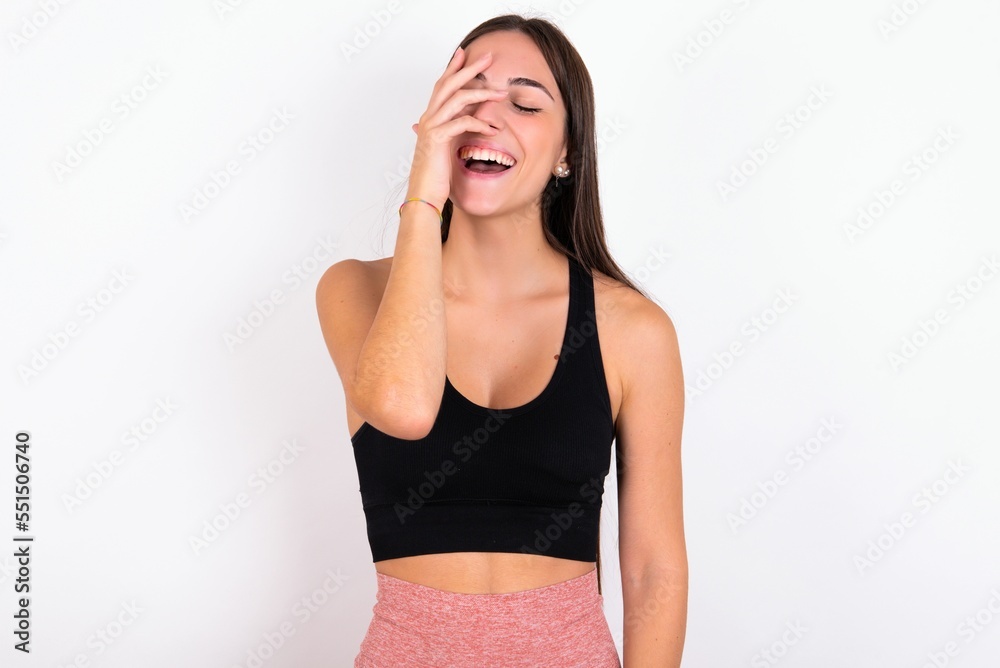 Charismatic carefree joyful MODEL likes laugh out loud not hiding emotions giggling hear funny hilarious joke chuckling facepalm.