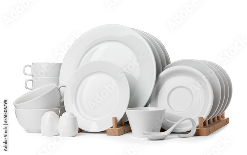 Set of clean dishware isolated on white photo