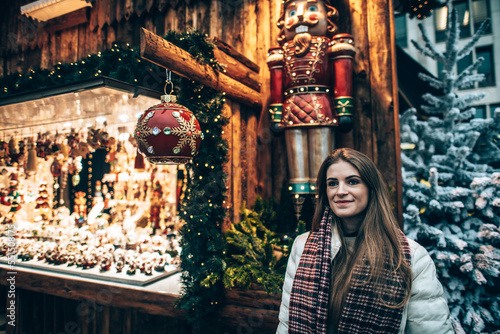 Girl in Winter lights Christmas market in the center of Luxembourg city photo