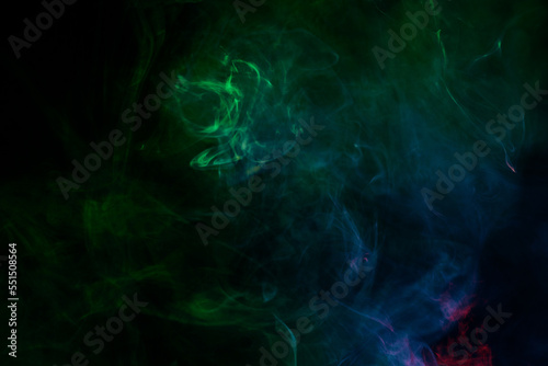 Green and pink steam on a black background. © Nikolay