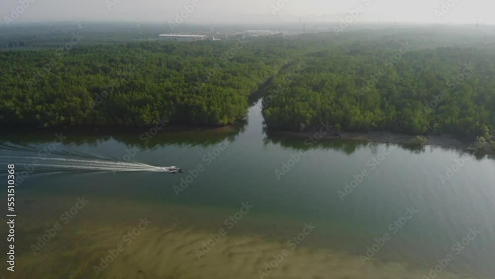 Drone View of boat cruising on the Bagan Lalang river in the morning, Malaysia Drone View of boat cruising on the Bagan Lalang river in the morning, Malaysia