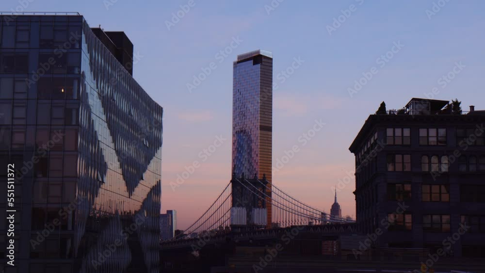One Manhattan Square Skyscraper And Manhattan Bridge During Sunset In Manhattan, New York City, United States. - wide One Manhattan Square Skyscraper And Manhattan Bridge During Sunset In Manhattan, New York City, United States. - wide