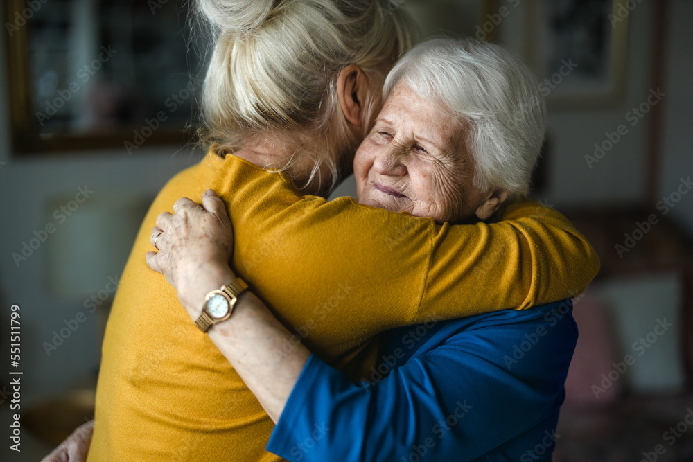 Woman hugging her elderly mother
 - obrazy, fototapety, plakaty 