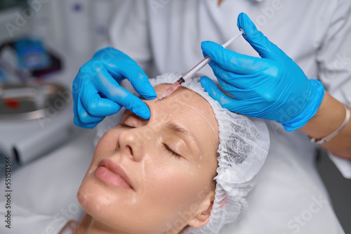 Anti-aging treatment and filler injection between eyebrow concept