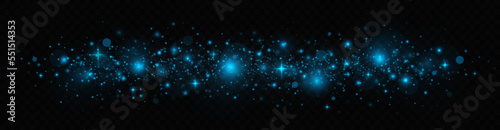 Shiny dust sparks and stars with light effect. Glitter bokeh lights is isolated on a transparent background. Blue glow light effect.